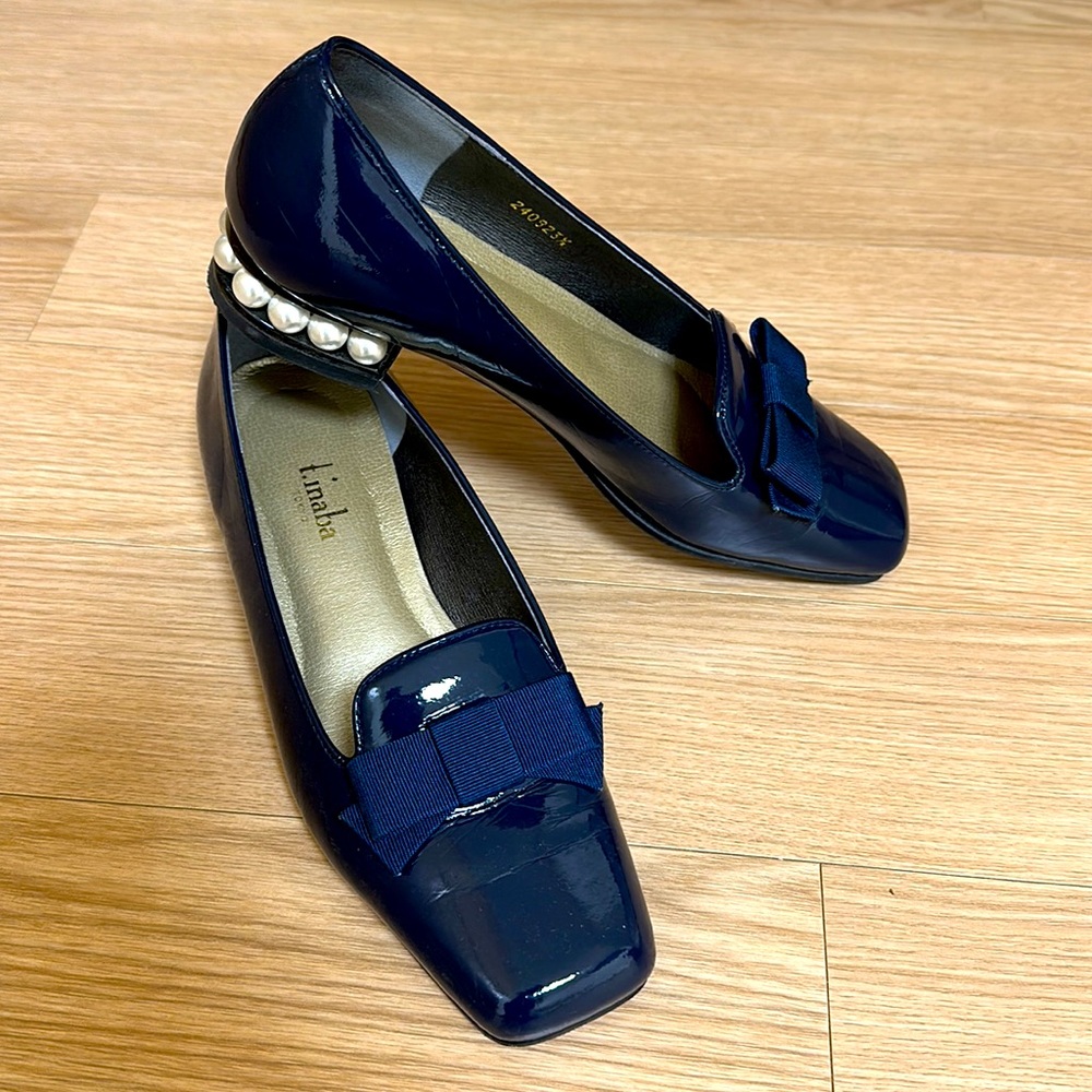 Navy patent low heel loafers.